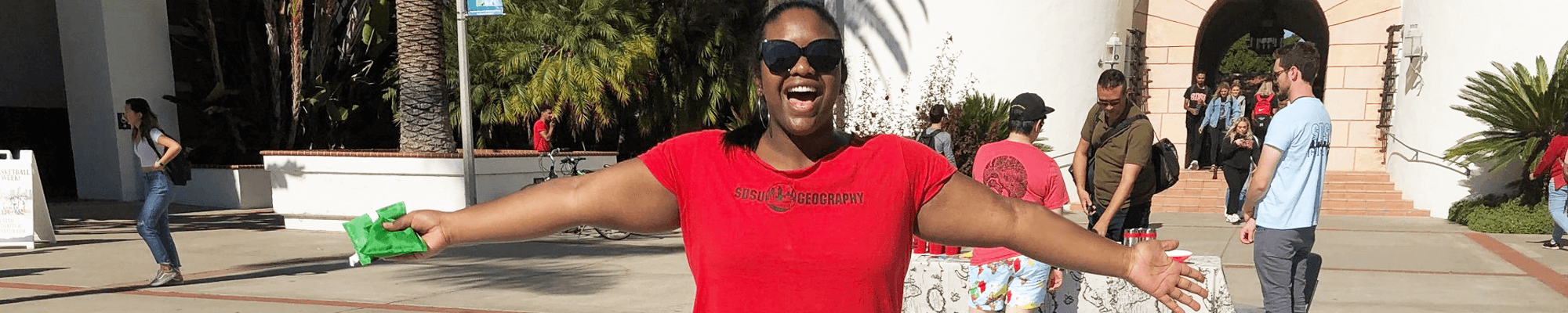 geography student, female, in front of Hepner Hall, arms open wide, 